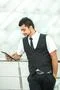 The indian businessman stand by business center work with the tablet Photo