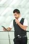 The indian businessman stand by business center work with the tablet Photo
