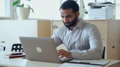 Indian businessman using laptop computer working in office looking at laptop. Stock Footage 164101433