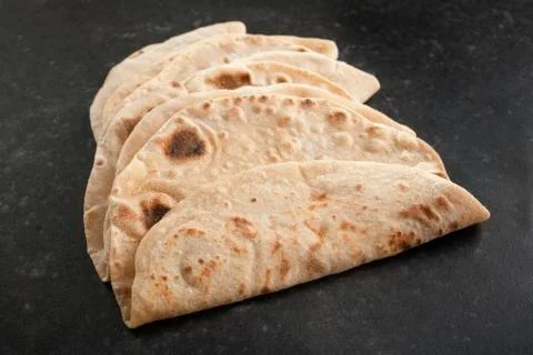 Indian chapatis on a dark background Stock Photos