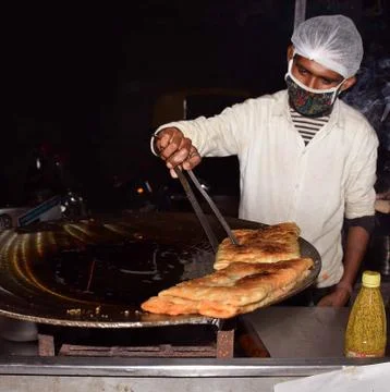 Indian chef preparing paratha Stock Photos