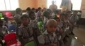 Indian children receiving candies at school HD Footage