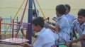 Indian children spinning in a mary go round HD Footage