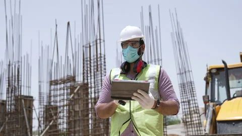 Indian civil Engineer using digital tablet for checking details on site. Stock Footage 162019808
