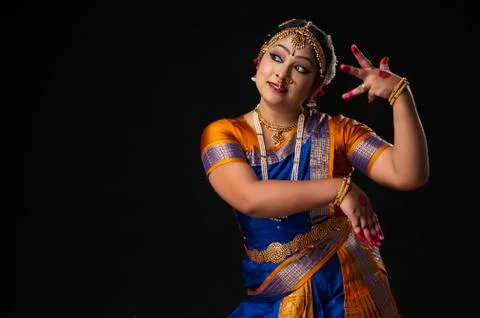 Indian classical dancer performing on stage	 Stock Photos