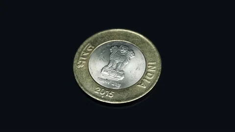 Indian coin 10 rupees 2015 release rotates on a black background. Macro. Closeup Stock Footage 121606388