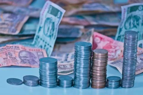 Indian coins stack in form of bar graph with indian rupees Stock Photos