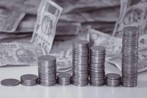 Indian coins stack in form of bar graph with indian rupees Stock Photos