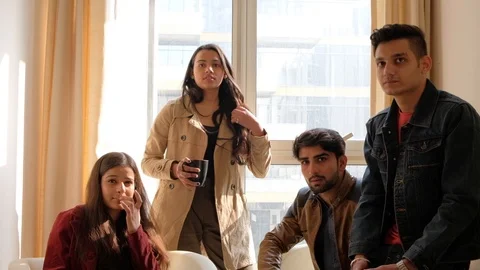 Indian colleagues discuss with someone off camera with a camera pov static Stock Footage 101159835