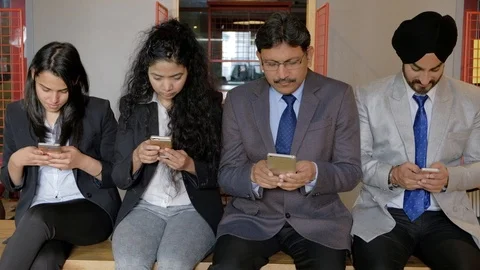 Indian colleagues using technology  mobile phones touch screen for communication Stock-Footage 102156477