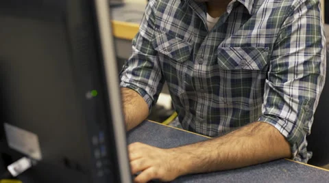 Indian college student working at computer station tilt shot 4k 스톡 동영상 65298144