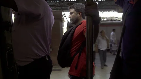 Indian commuter is jumping off of the train before it stops 스톡 동영상 90965086