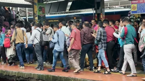 Indian Commuters travel on local train during peak hours. 4K Stock Footage 246921853