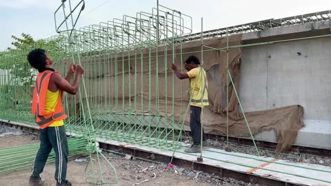 Indian Construction Workers Assembling Reinforcement Steel Cage for Bridge 4K Stock Footage 336942727