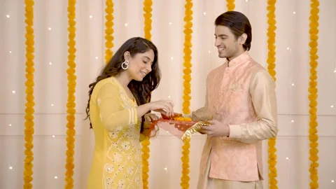 Indian couple decorating Prayer plate Stock Footage 249398457