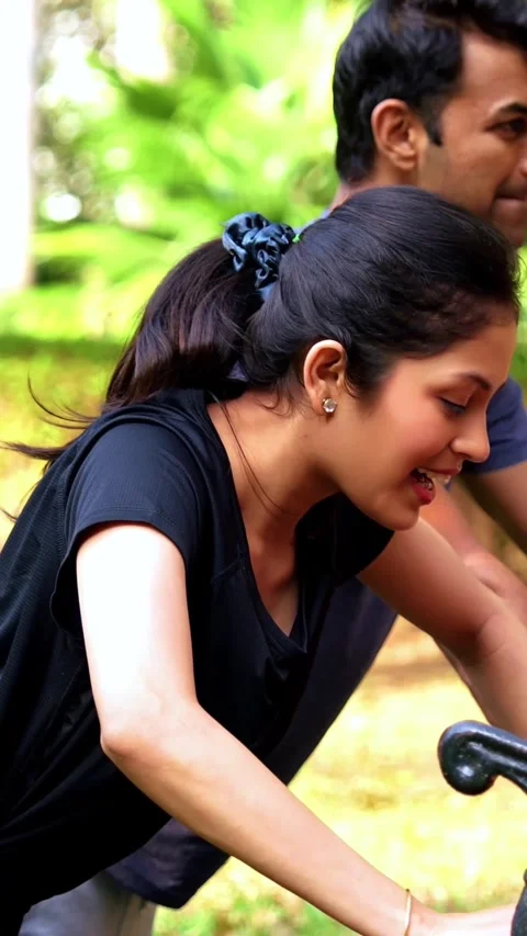 Indian couple doing pushups together on park bench maintaining fitness Stock-Footage 342843688