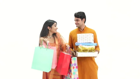 Indian couple with gift boxes and some shopping bags for diwali. Stock Footage 253263327