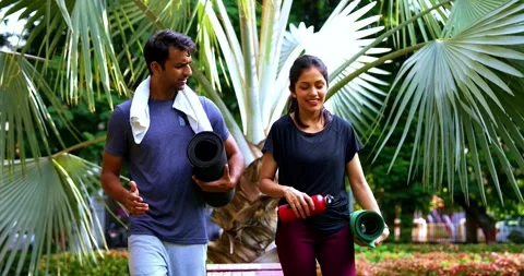 Indian couple giving high five after yoga outdoors enjoying fitness, fresh air Stock-Footage 342844739