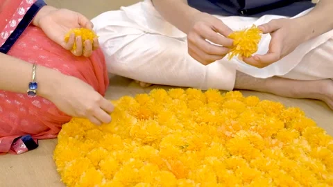 Indian couple making Rangoli using flowers Stock Footage 249401056