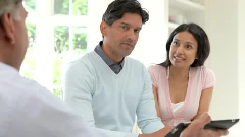 Indian Couple Meeting With Financial Advisor At Home Stock Footage