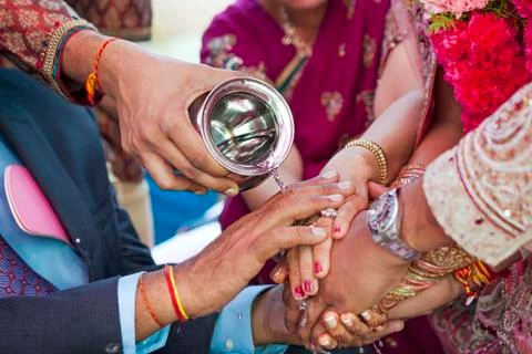 Indian couple performing wedding ceremony Stock Photos