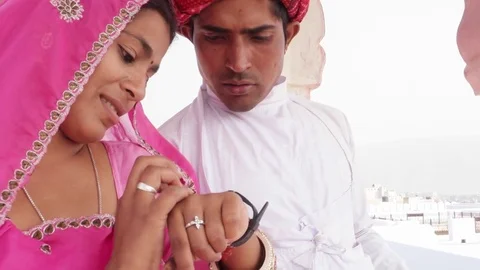 Indian couple sharing a smart watch and discussing showing learning health  Stock Footage 70340352