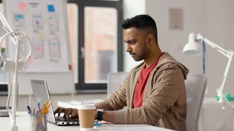 Indian creative man working on laptop at office Stockbeeldmateriaal 88148584
