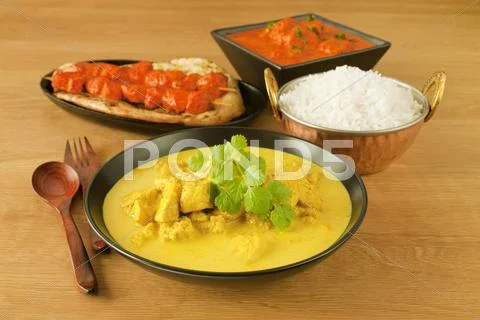 Indian cuisine food meal curry chicken tikka masala rice naan Stock Photos