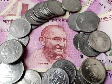 Indian currency 2000 rupees note, Mahatma gandhi in center with coins around Stock Photos