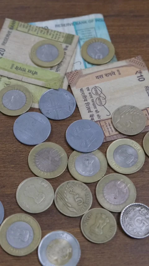 Indian Currency Notes and Coins on Wooden Surface Stock Footage 332228276