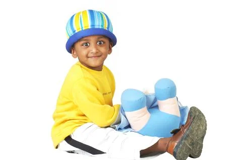 Indian Cute Boy with Doll in Studio Stock Photos