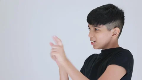 Indian cute boy going back with fear side view  he is wearing black dress in Stock Footage 159594028