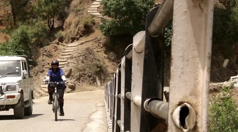 Indian cyclist on the bridge Stockbeeldmateriaal 45310436