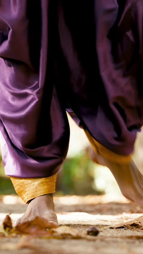 Indian dancer performing traditional dance steps barefoot outdoors Stock Footage 332606654