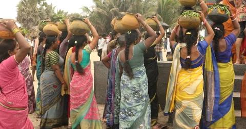 Indian devotees gathered on the beach during a spiritual ritual Stock Footage 317561081