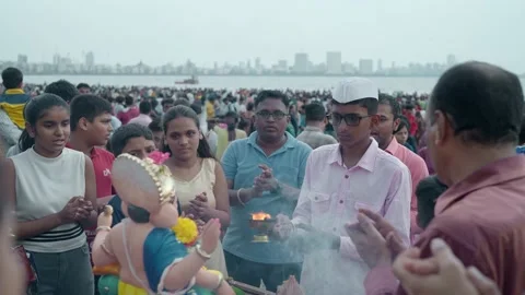 Indian devotees offering aarti to lord ganesha on Ganesh Chaturthi festival Stock Footage 231599931