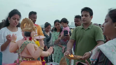 Indian devotees offering aarti to lord ganesha on Ganesh Chaturthi festival Stock Footage 231600992