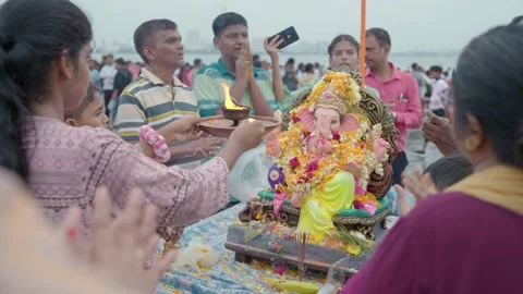 Indian devotees offering aarti to lord ganesha on Ganesh Chaturthi festival Stock Footage 231601037