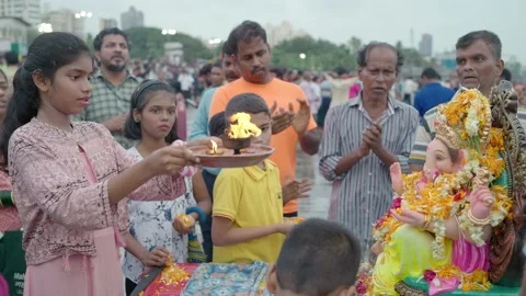 Indian devotees offering aarti to lord ganesha on Ganesh Chaturthi festival Stock Footage 231601096