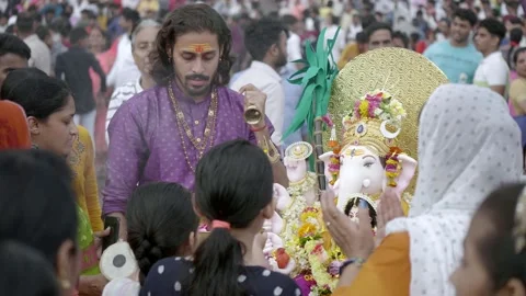 Indian devotees offering aarti to lord ganesha on Ganesh Chaturthi festival Stock Footage 232762122