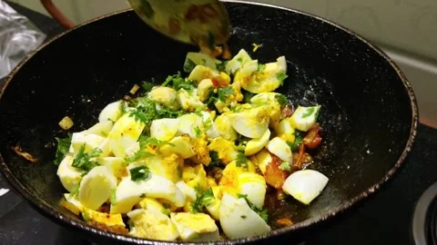 Indian Egg Masala Cooking with Boiled Eggs and Fresh Coriander Stock Footage 337998178