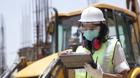 Indian engineer doing survey with pc tablet on construction site. Vídeos de archivo 162021080