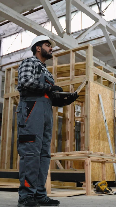 Indian engineer inspecting SIP panel house manufacturing Stock Footage 301828031