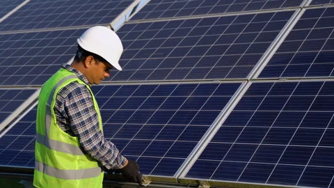 Indian engineer working setup solar panel at the roof top Stock-Footage 253661076