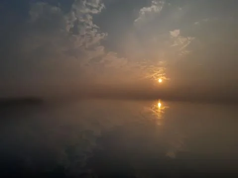 Indian environment, sunset time cloud sky and sun light reflection. Stock Photos