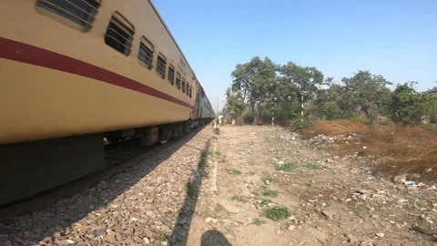 Indian Expressing train passing through Rural India Hi speed Stock Footage 197512839