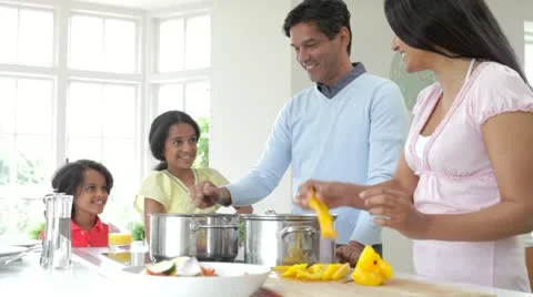 Indian Family Cooking Meal At Home Stock Footage