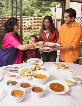 Indian family at dinner table Stock Photos