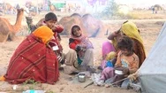 Indian Family Outdoors In Desert On Time Pushkar Camel Mela, Rajasthan, India Stock Footage