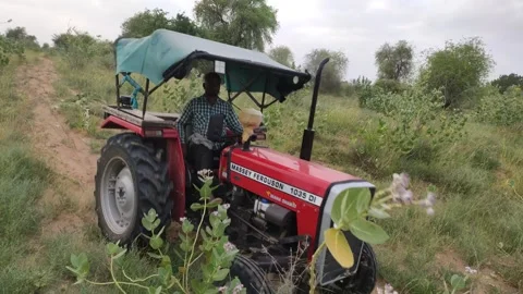 A indian farmer driving tractor Stock Footage 301418978